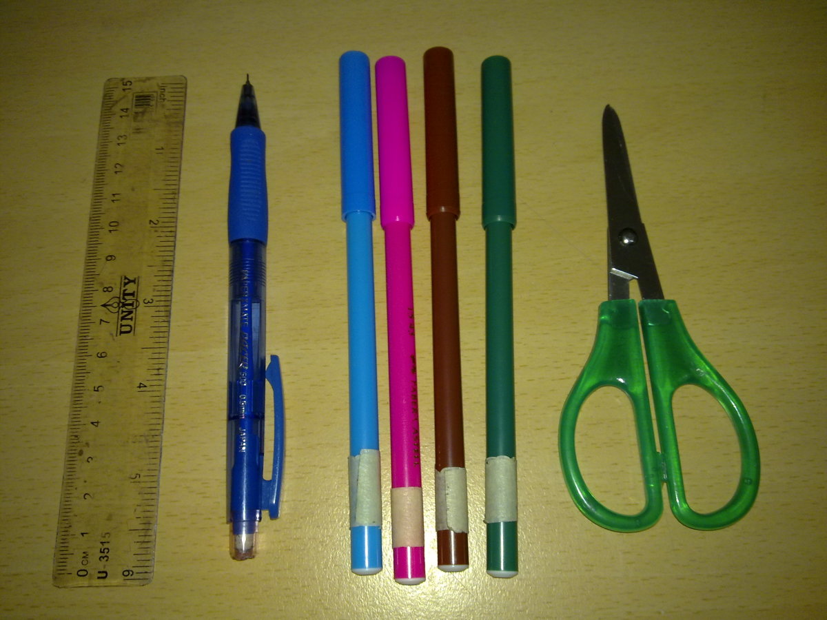 Ruler, a pencil, some markers and a pair of scissors