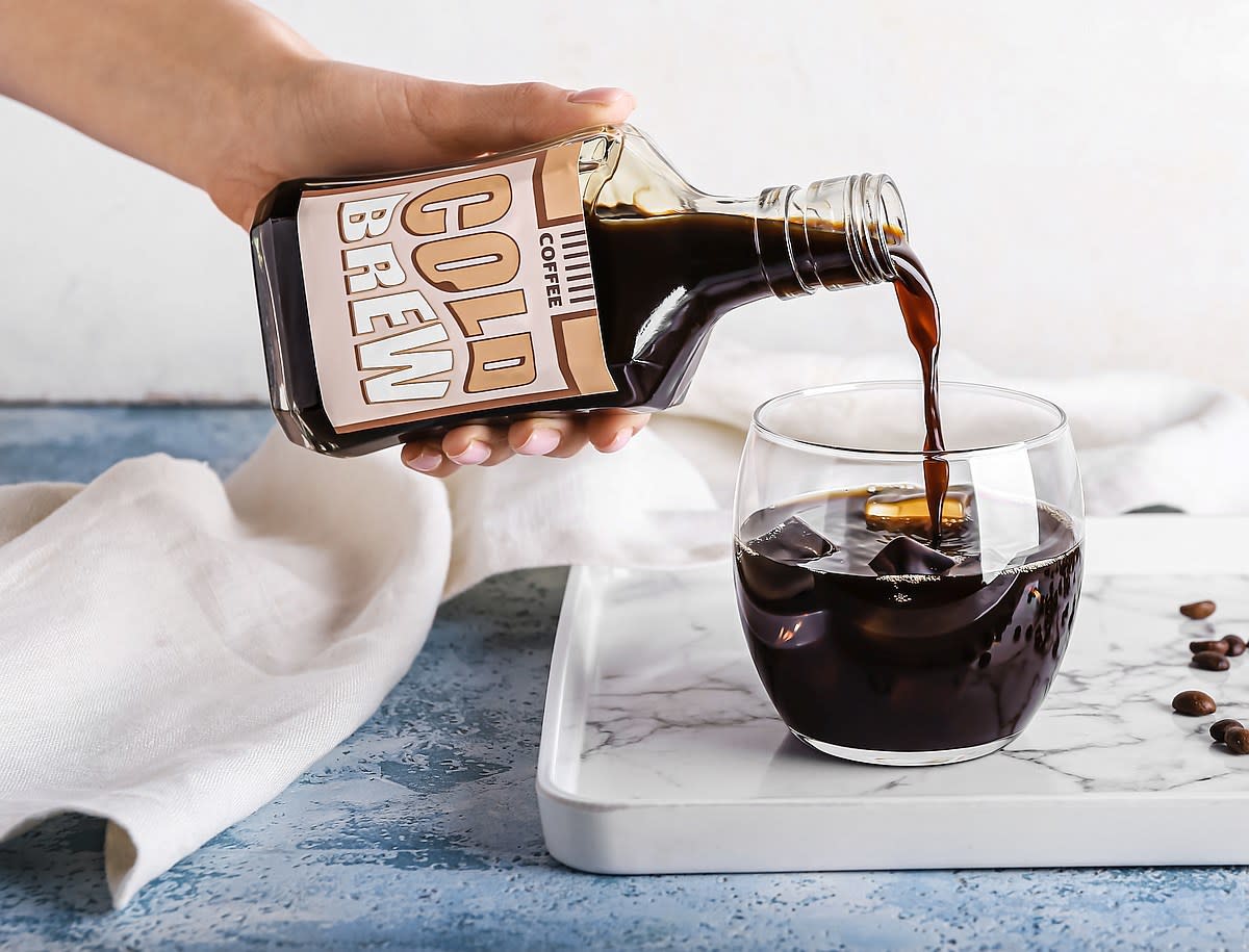 Poring Cold Brew over ice