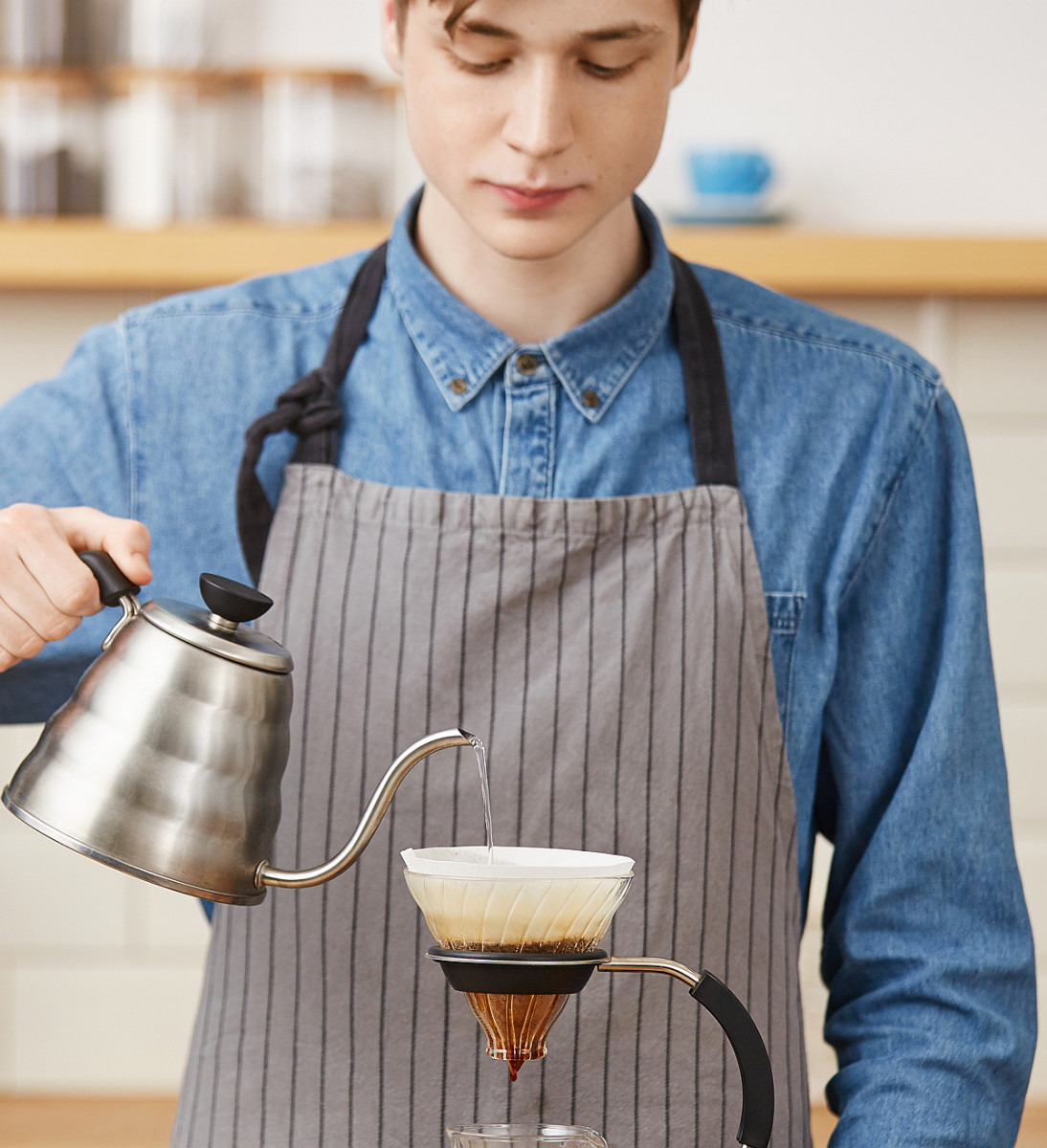 Barista making pour-over coffee