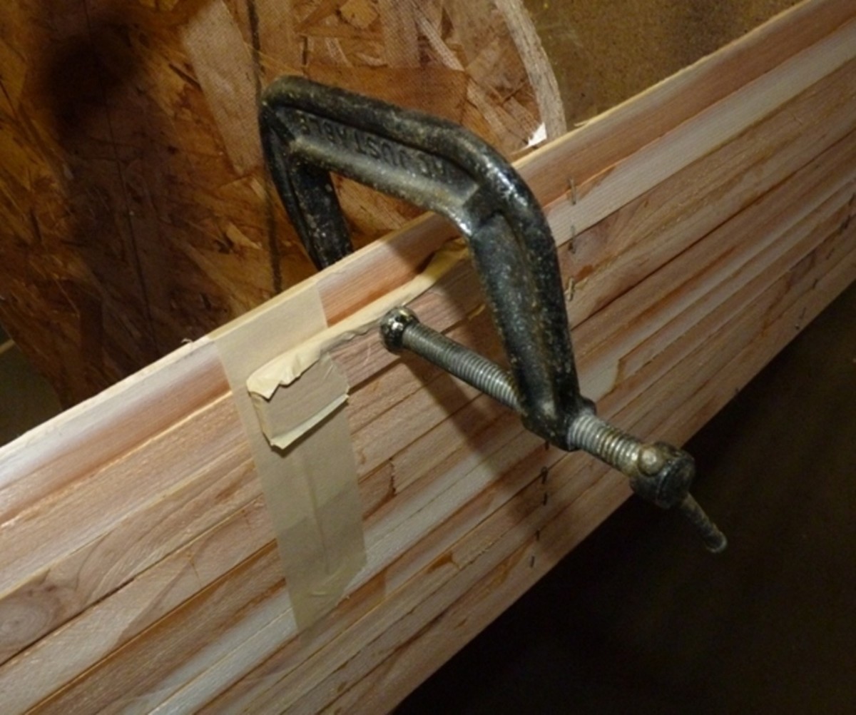 A scrap strip piece clamped at a butt joint