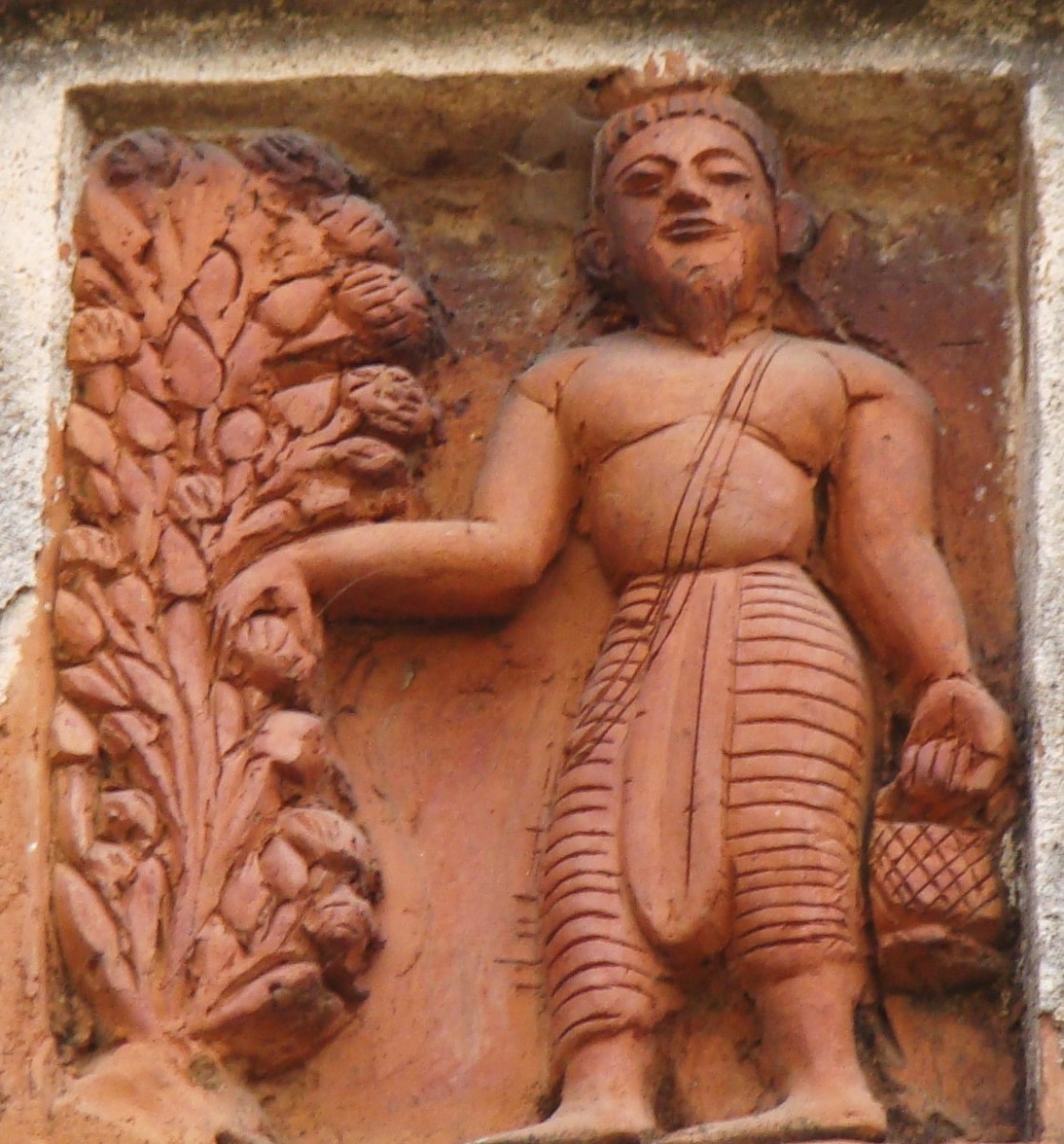 A priest wearing  the sacred thread; terracotta; Sridhar temple, Sonamukhi, Bankura