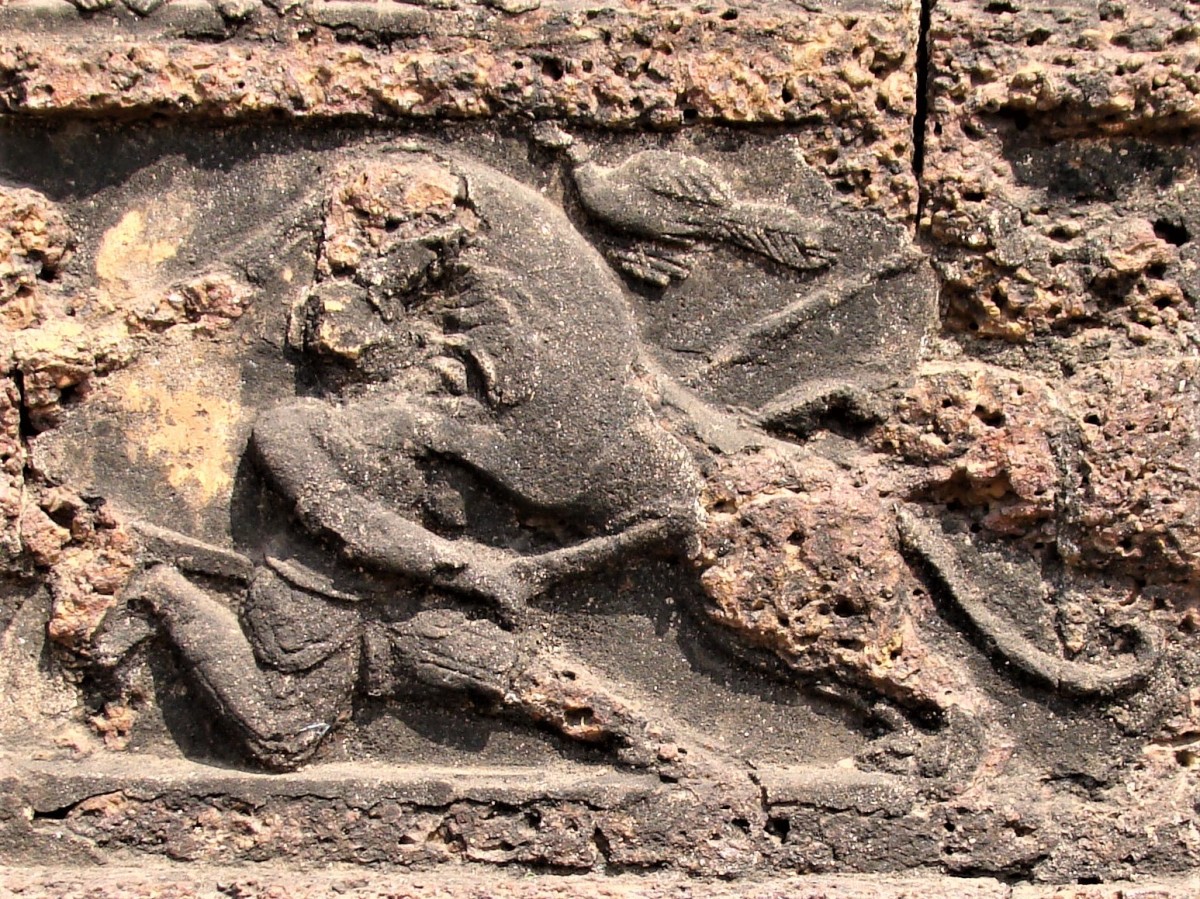 Tigder hunting on foot; stucco on stone; Radha Shyam temple, Vishnupur