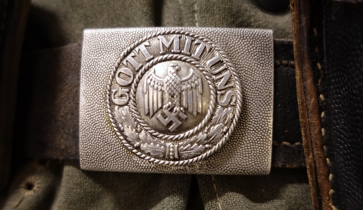 The standard-issue Nazi belt-buckle said "Gott mit uns" (God with us) on it.
