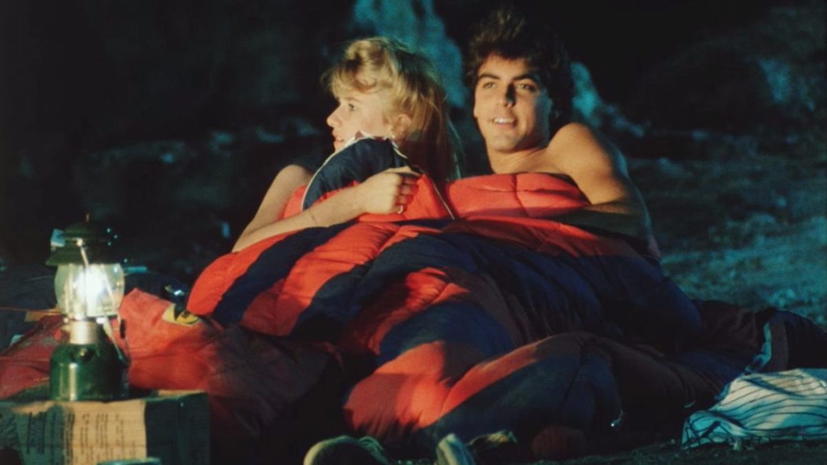 Tina (Laura Dern) and Ron enjoy a little romp in their sleeping bag before heading to the concert