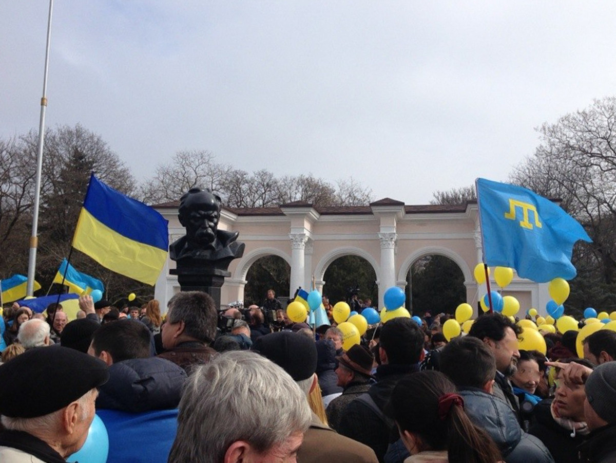 During Russia's military intervention in Crimea, a pro-Ukrainian demonstration in Simferopol (Ukrainian flag on the left, Crimean Tatar flag on the right) was held on March 9, 2014.