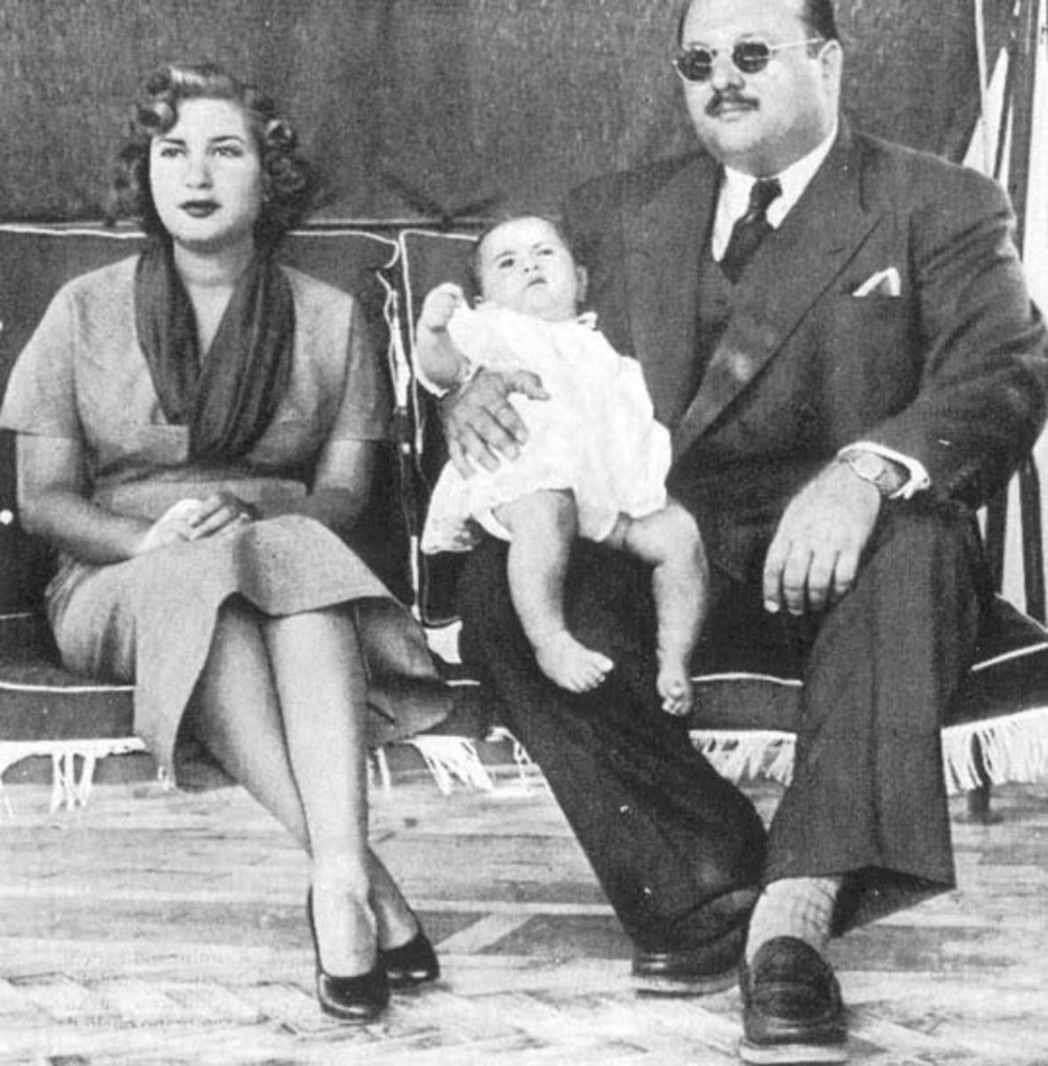 Ex-queen Narriman and the very corpulent Farouk with their son King Faud II in 1953.