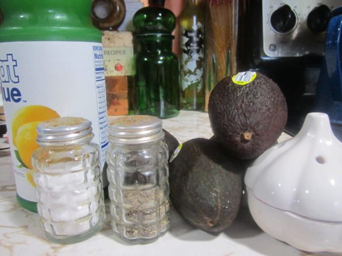 Avocados, garlic, and spices to make guacamole.
