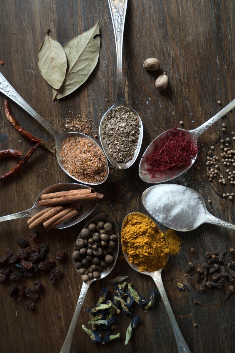 Spices on spoons.