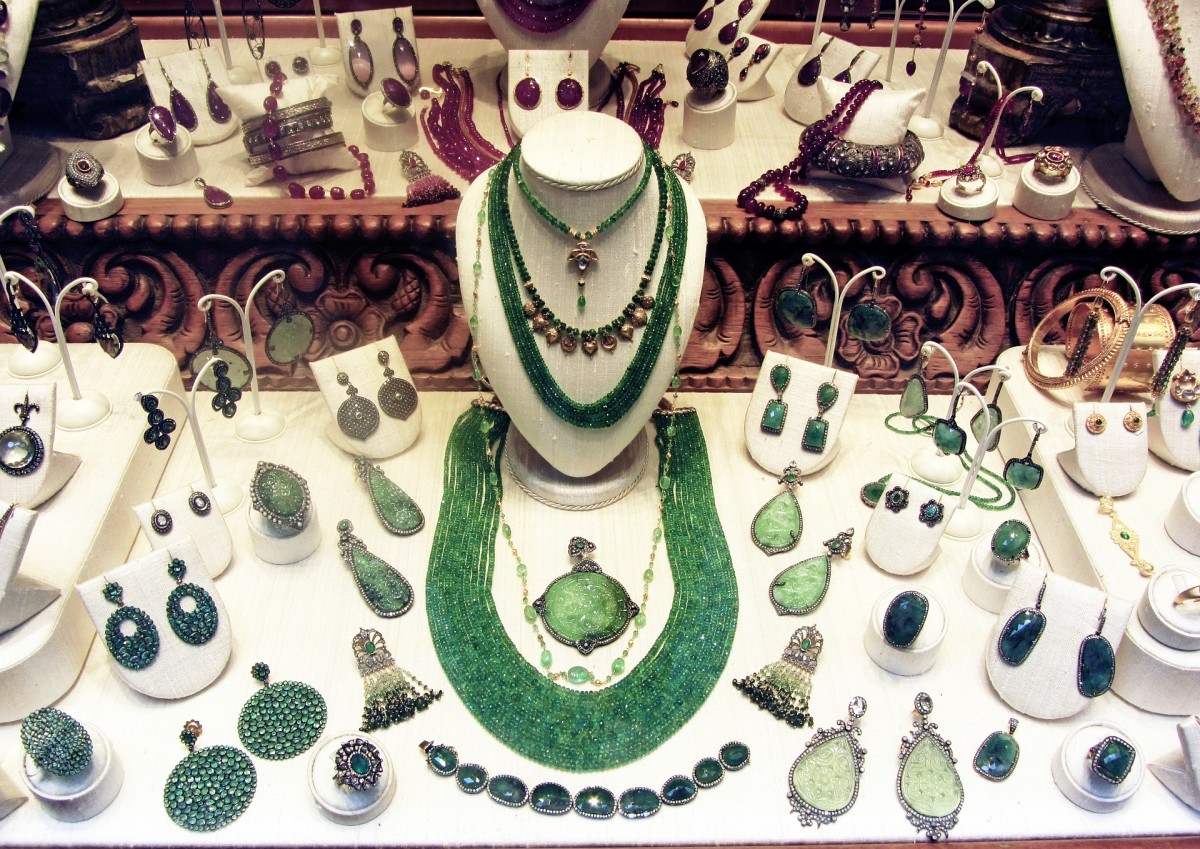 A display of jade necklaces, bracelet, and earrings on commercially constructed display stands. 