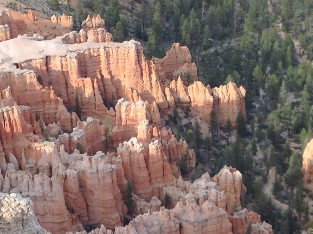 Hoodoos are formed when ice erodes the soft rock below but leaves the top covered with harder rock. It's visible in this photo at the back left where tops of entire groups of columns remain in place.