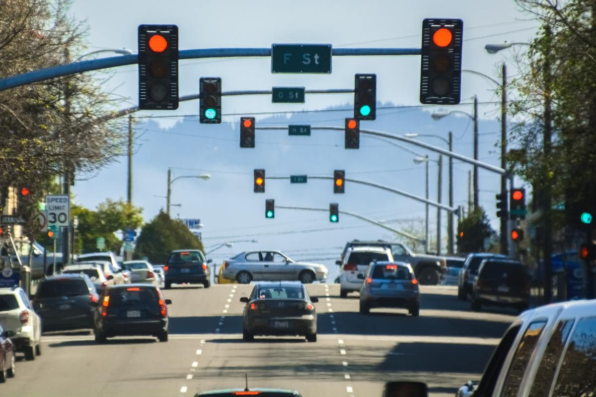 Why does it take so long for traffic lights to turn green, and can anything be done about it?