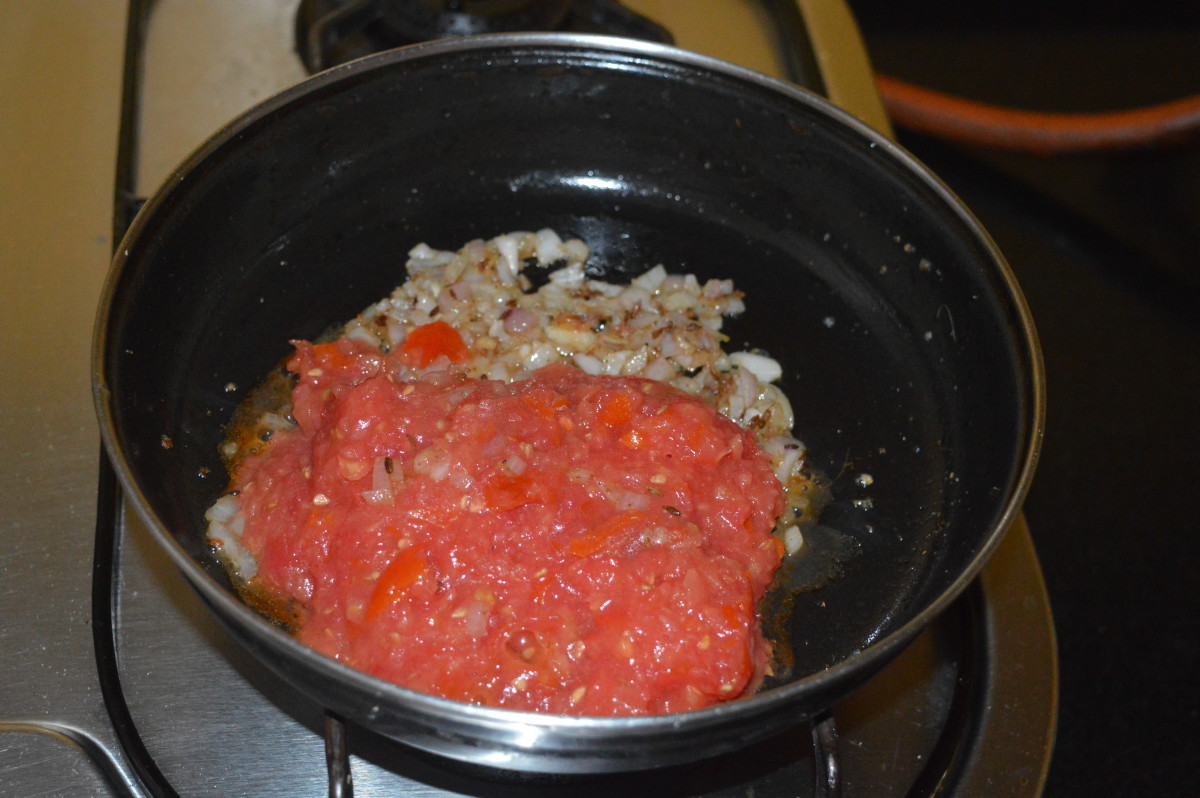 Increase the heat and add chopped tomatoes.