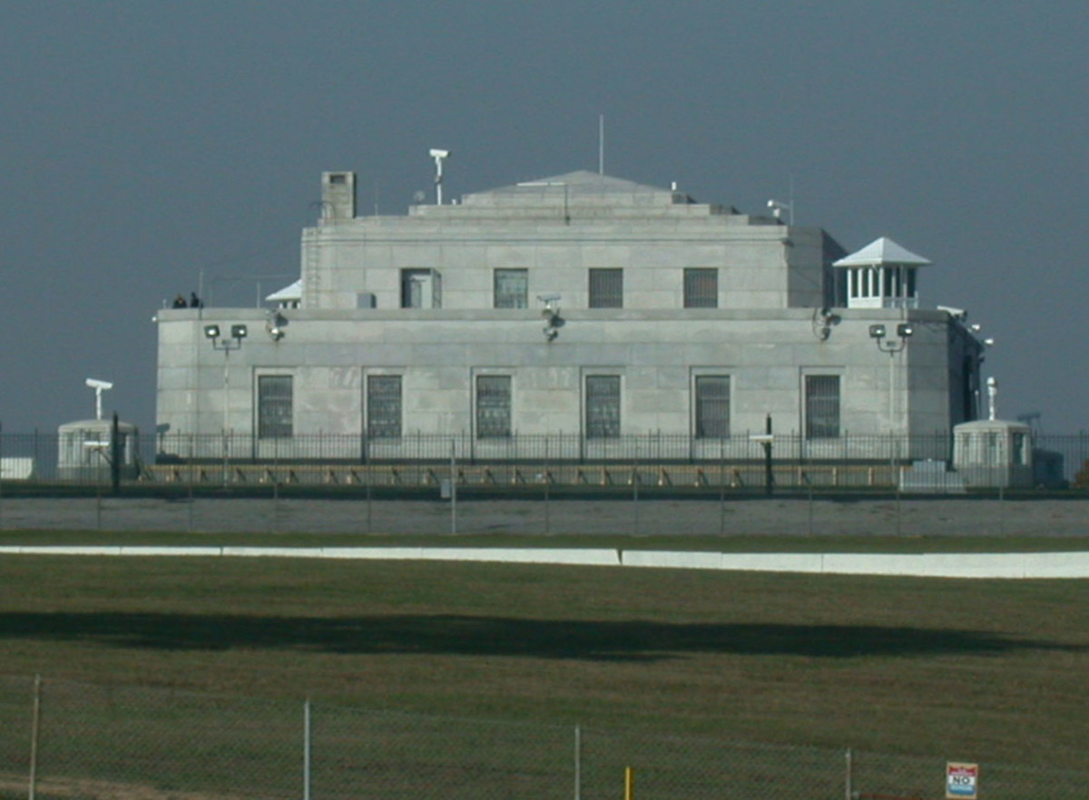 The United States Bullion Depository in Kentucky. Notice the cameras, wire fences, and guard towers.