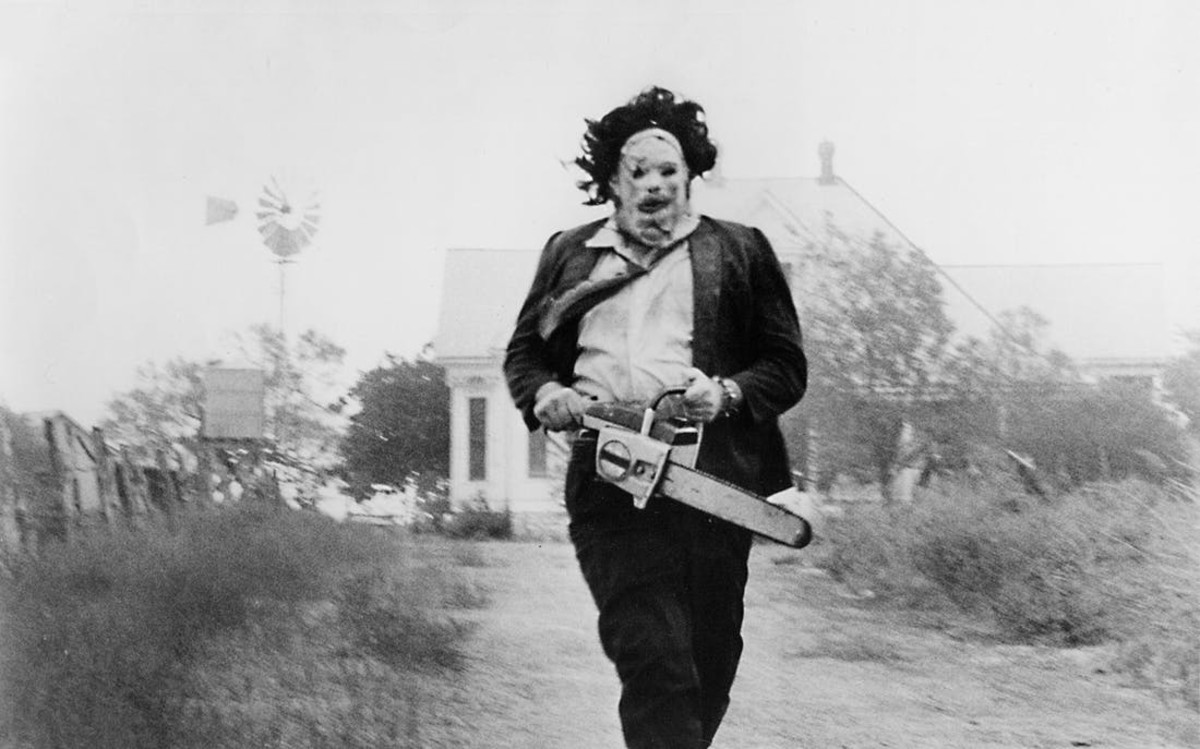 Leatherface chasing a victim with his iconic chainsaw!