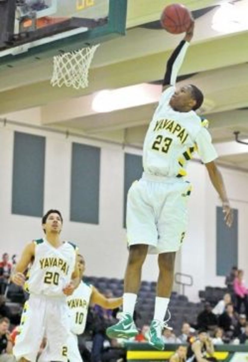 My stepson, David Hall, goes up for a slam dunk while playing at Yavapai College.  He scored 22 points in that particular game.