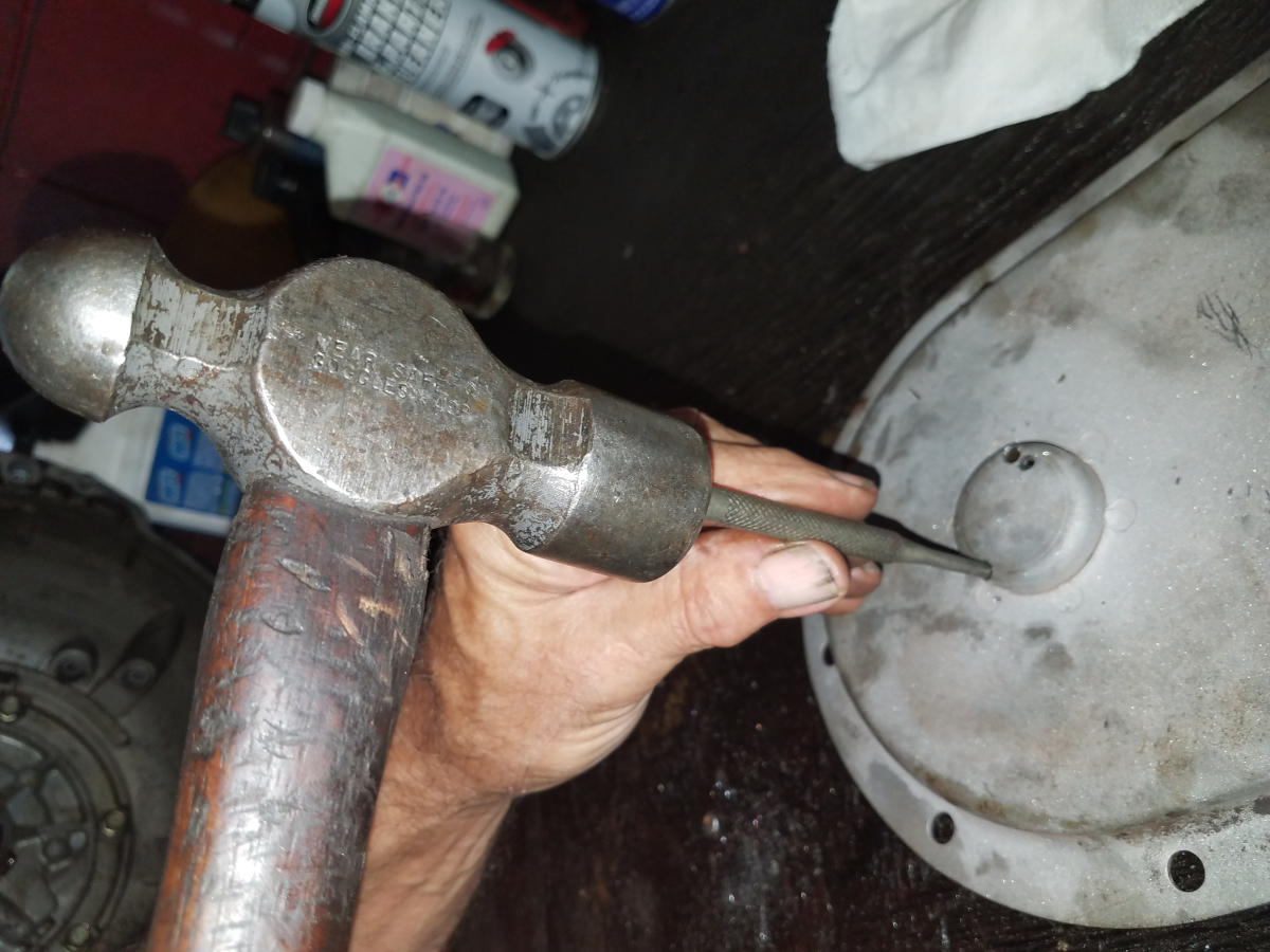 hammer and punch used to drive out old bearings