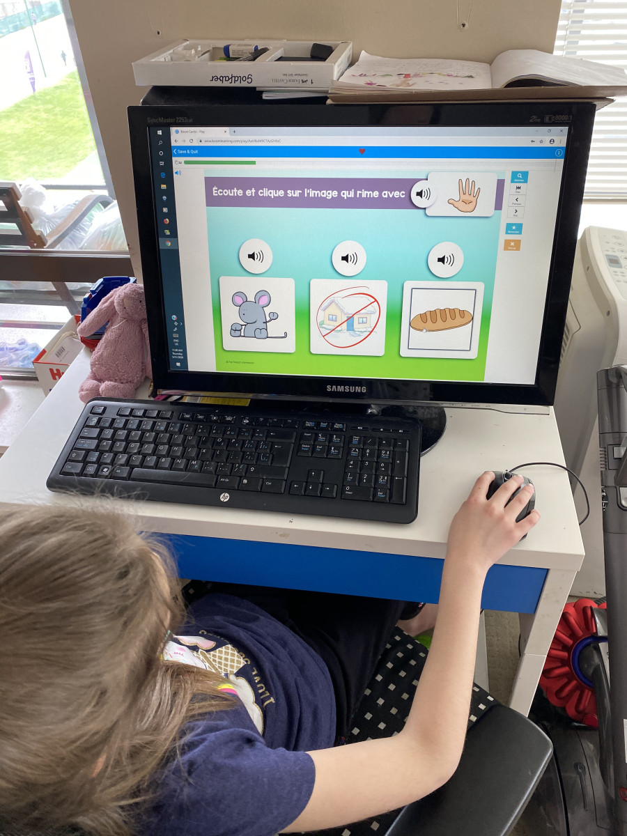 My daughter using an online reading and listening audio program.  The images are user friendly and the icons are large and easier to click on. 