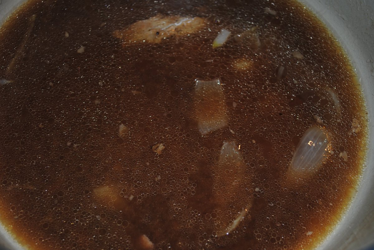 The juices left in the pan after the meat and veggies are removed.