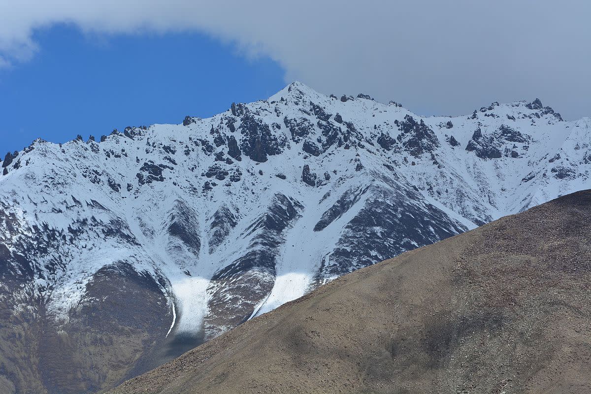 view of a mountain peak, on the road to khardungla pass