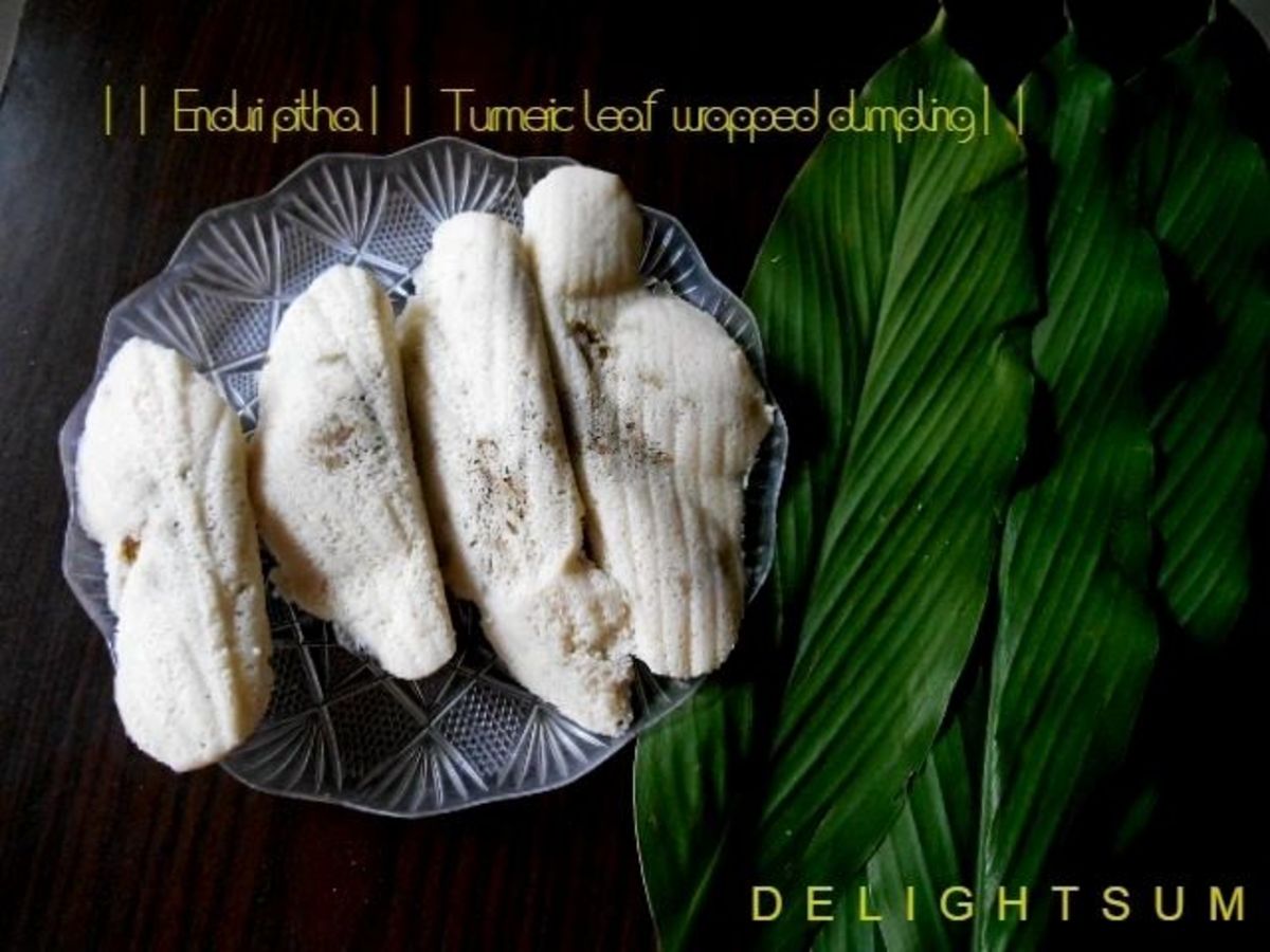 Enduri Pitha ( Turmeric Leaf Wrapped Dumpling )