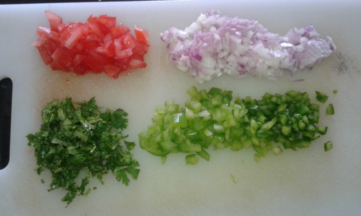 Chop veggies for batter (tomato, onion, coriander leaves, capsicum) 