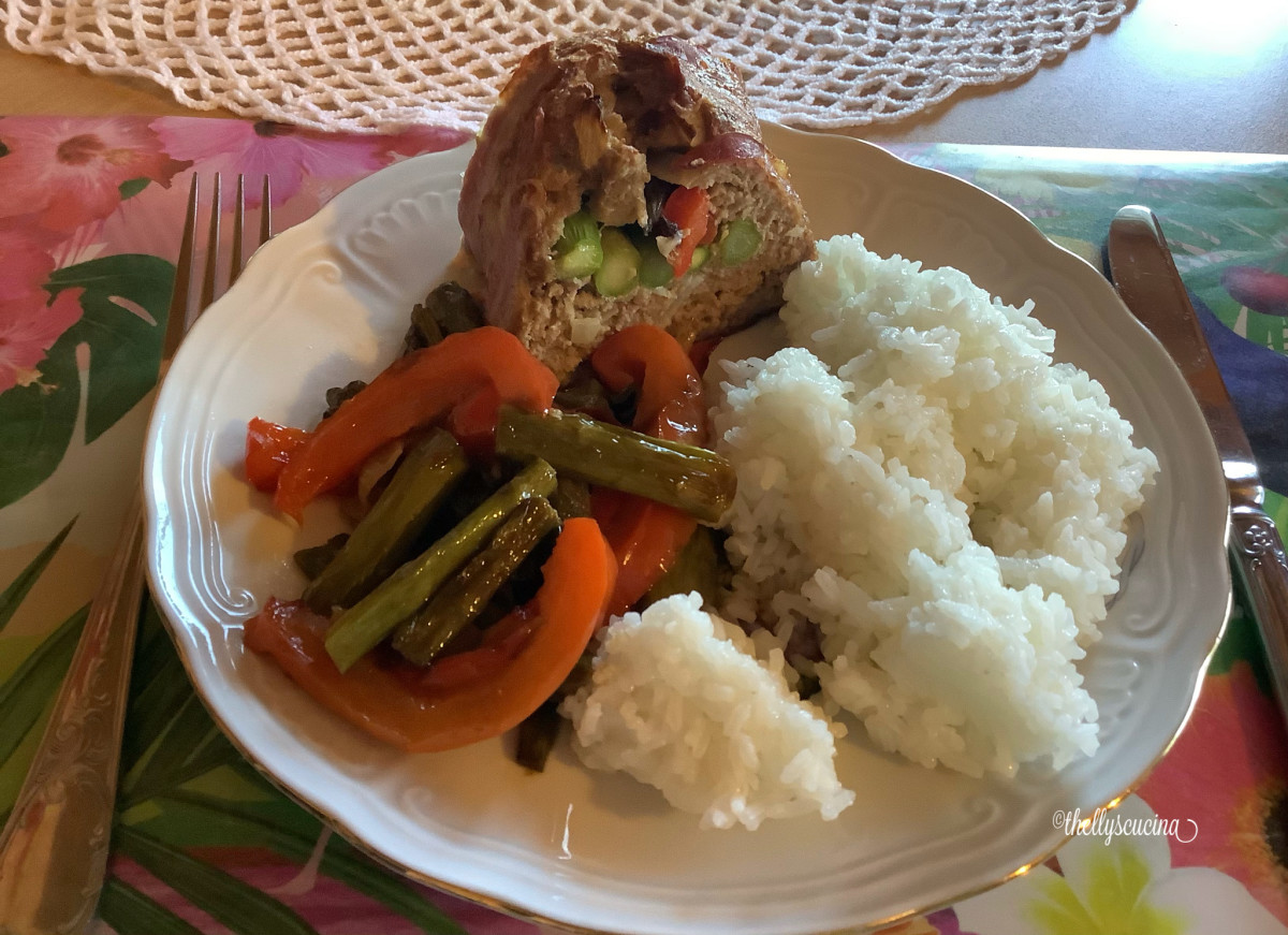 Serve the meatloaf with buttered asparagus, bell peppers, and boiled rice.