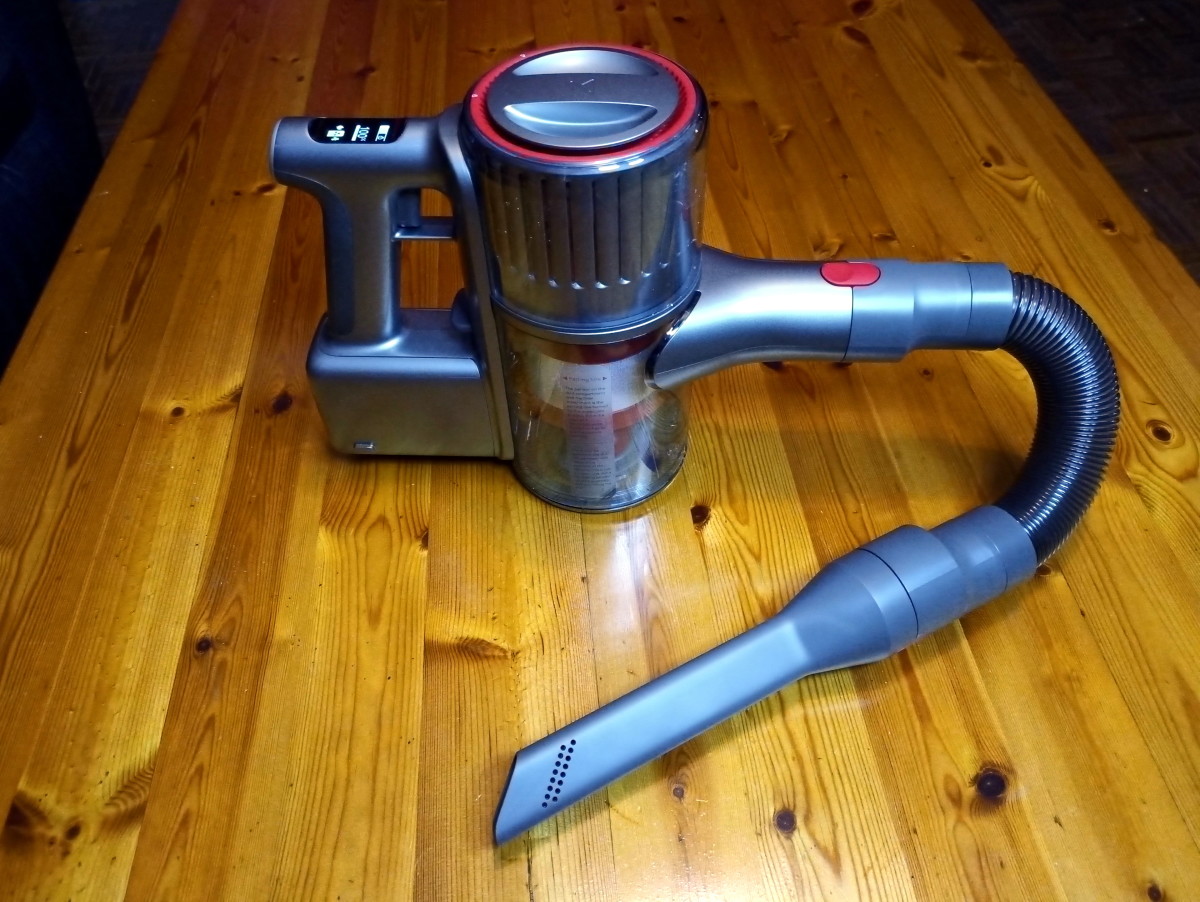 Crevice tool and flex tube attached to handheld vacuum