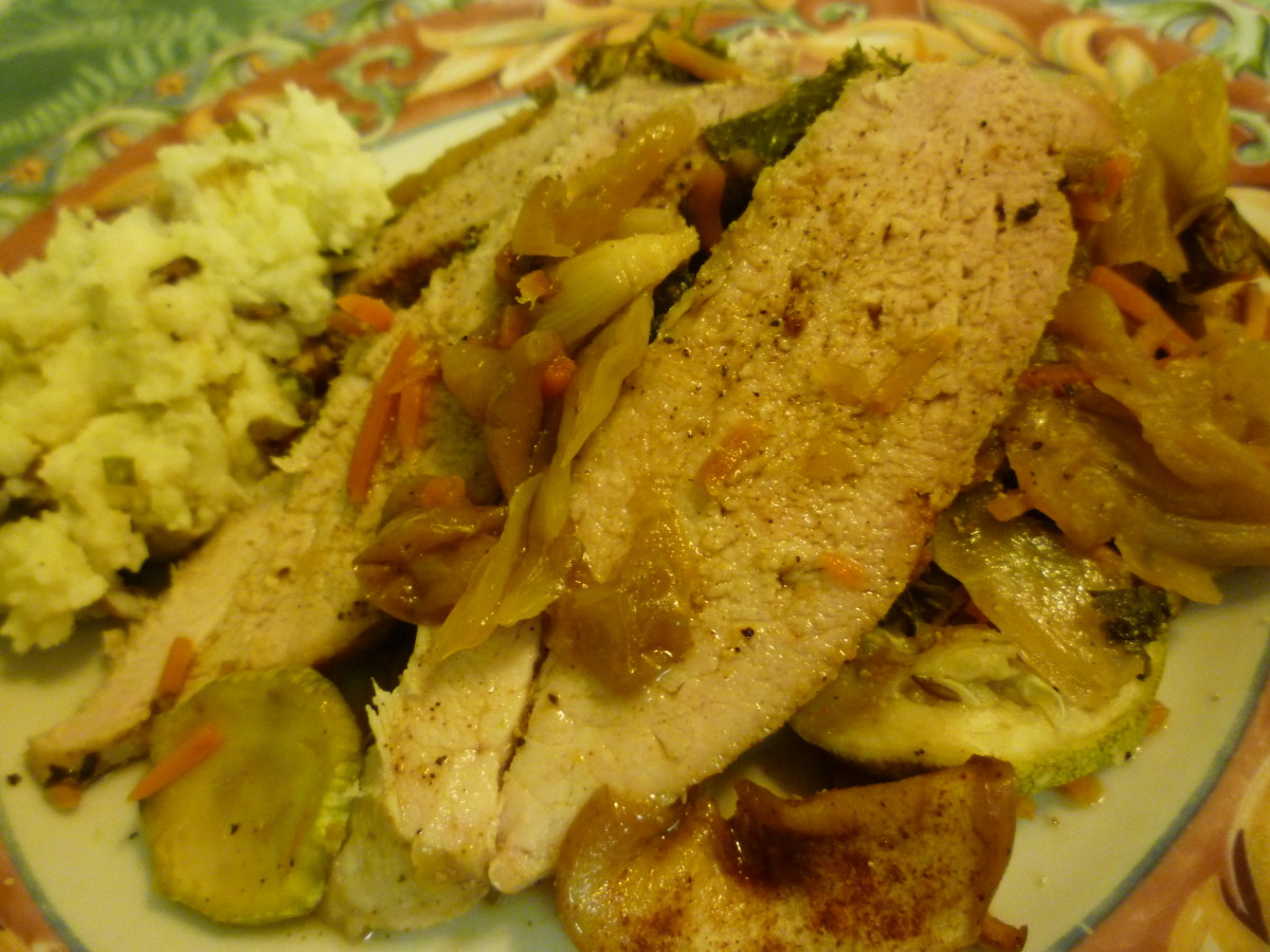 Sliced pork over a medley of vegetables with a side of horseradish mashed potatoes -  Delicious!
