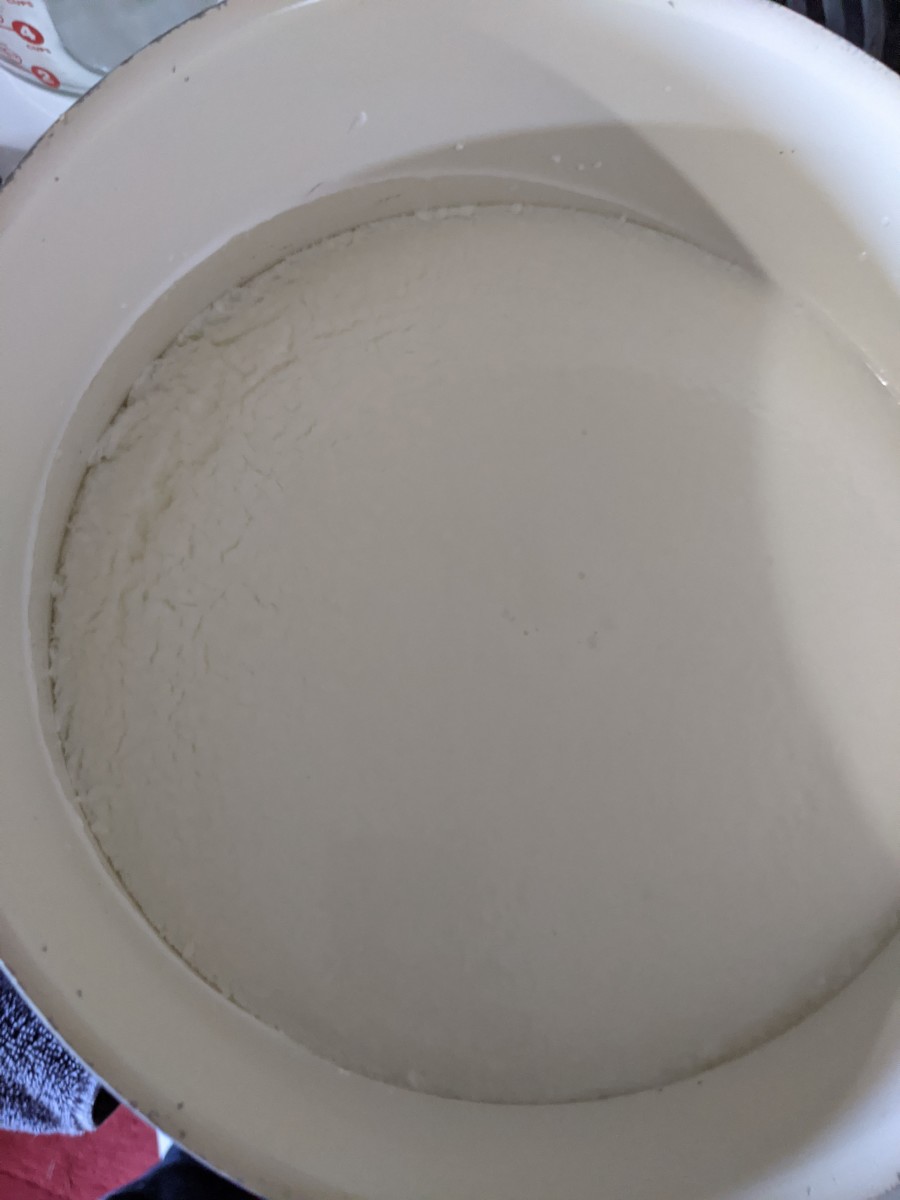 see how coagulation is occurring. The milk is getting more solid, separating and moving away from edge of pan.
