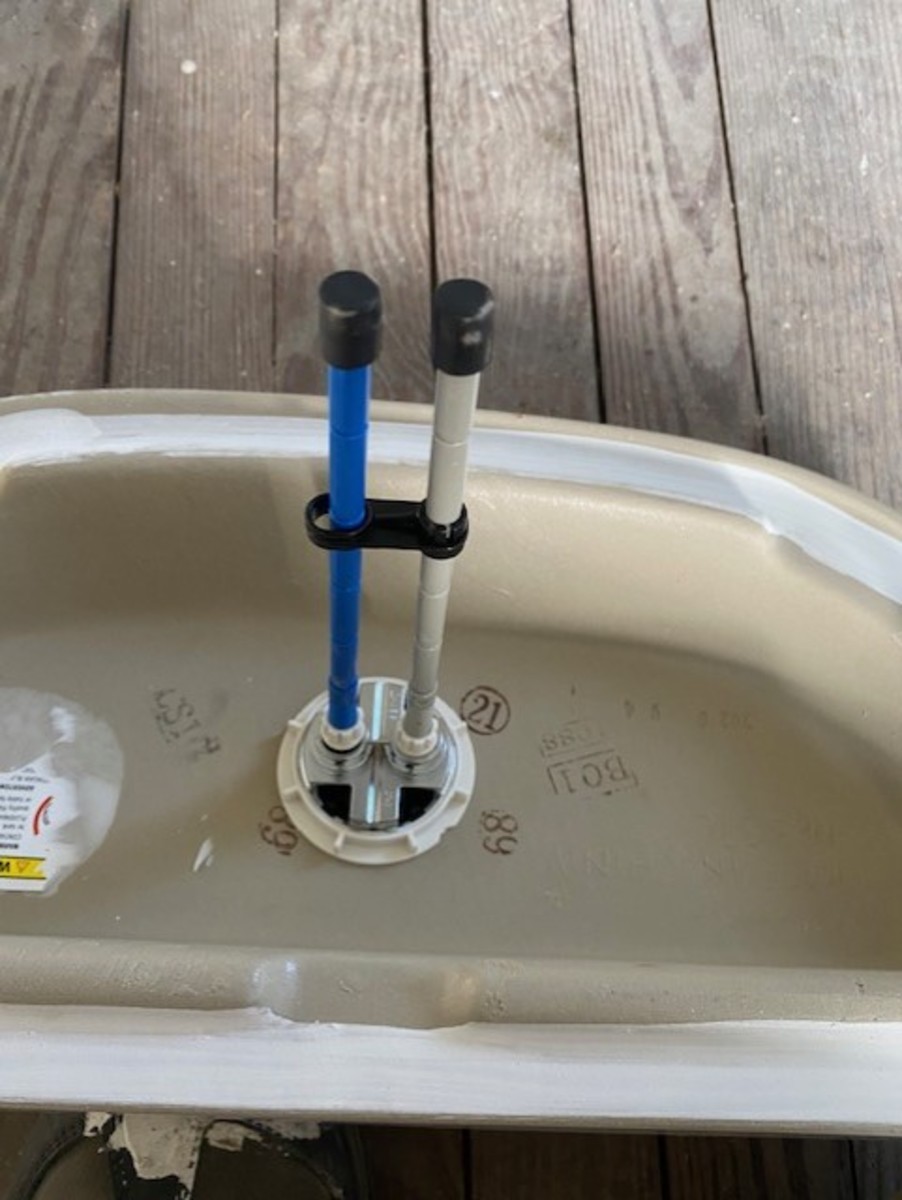 Underside of tank lid with flushing mechanism installed