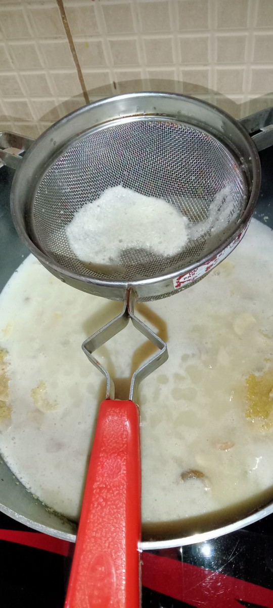 Add coconut milk and jaggery mixture to dalia by straining it through a strainer.