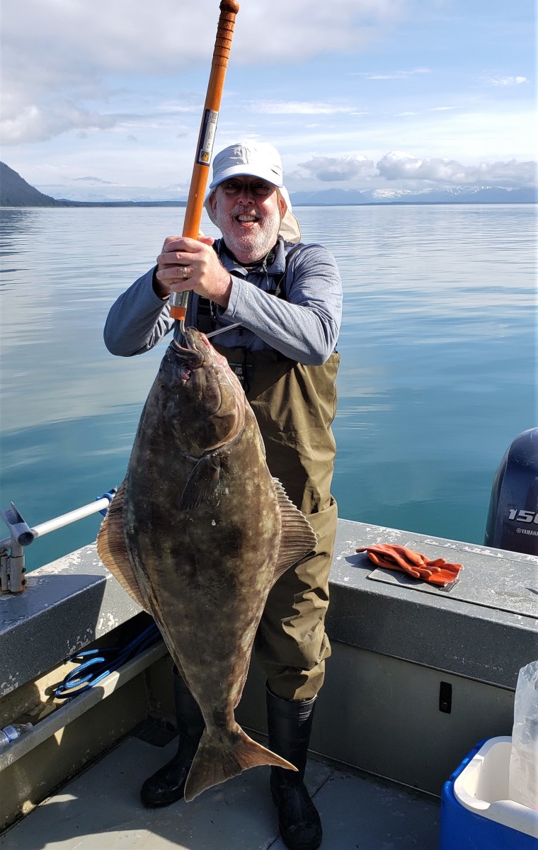 Our friend holding up his catch in Glacier Bay, Alaska