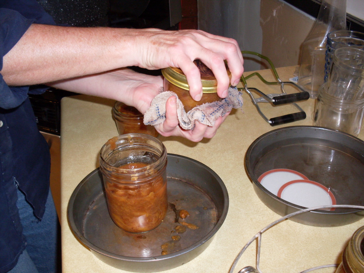 Using the ladle and funnel (if desired), fill your warm jars with hot jam, leaving 1/4-inch headspace.
