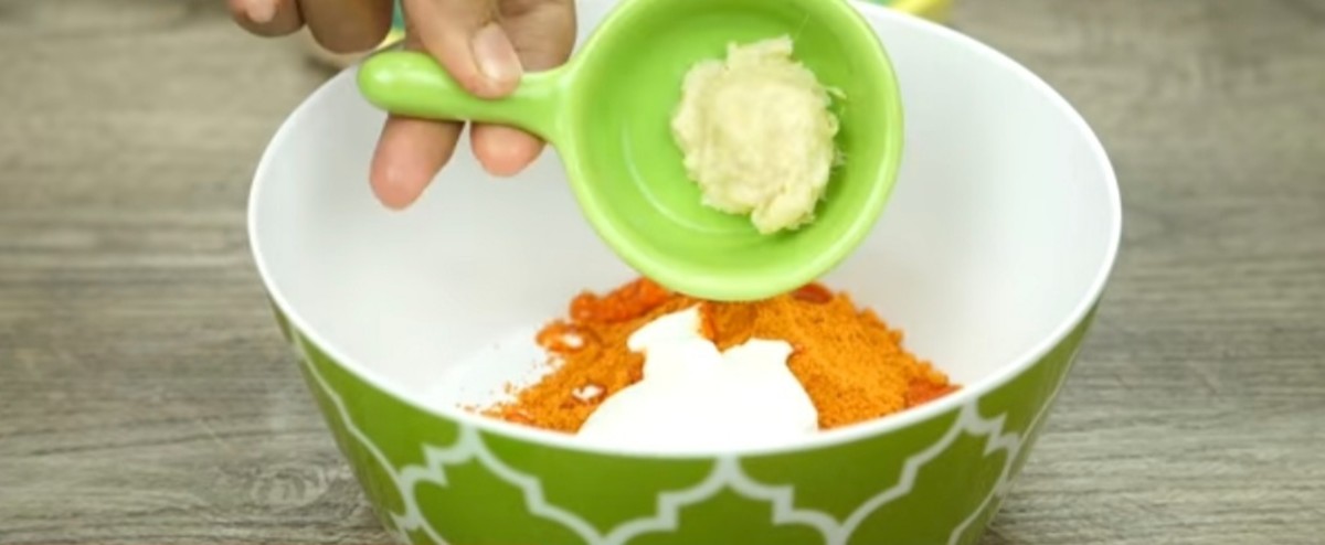 Step 6: In a bowl add tikka masala, yogurt, garlic paste and salt. Mix well.