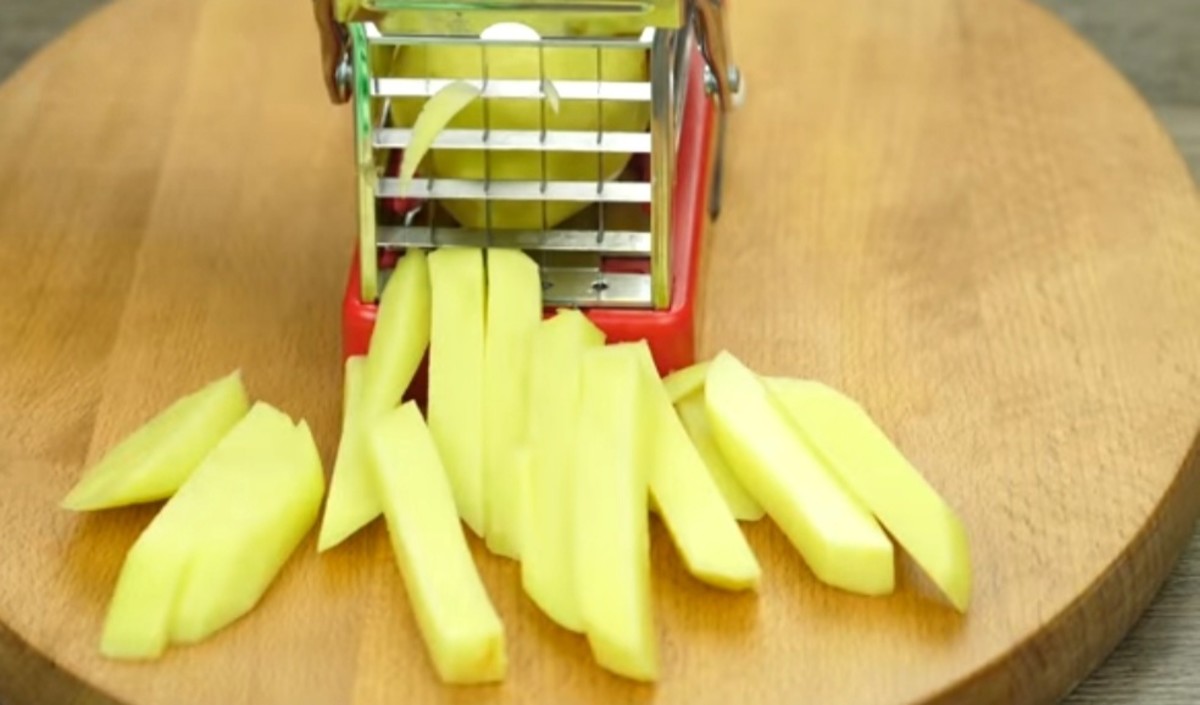 Step 1: Peel and cut the potatoes.