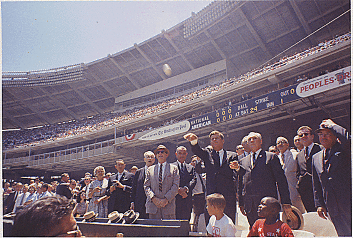 President John F. Kennedy throws out the first pitch at the first All-Star Game of the 1962 season, which was played in Washington, D.C.