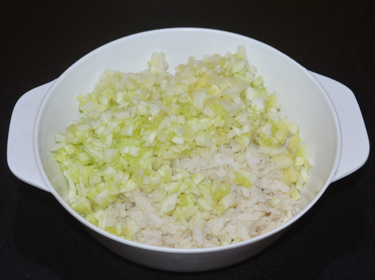 Add chopped cucumber to the bowl containing poha. 