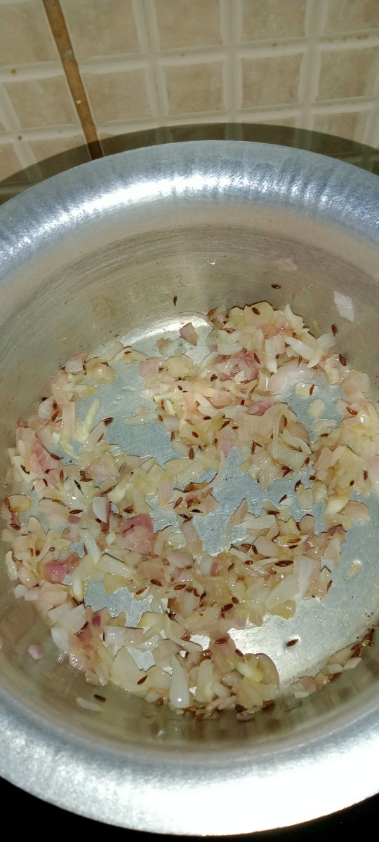 Add onion and mix well. Fry onion until golden brown. 