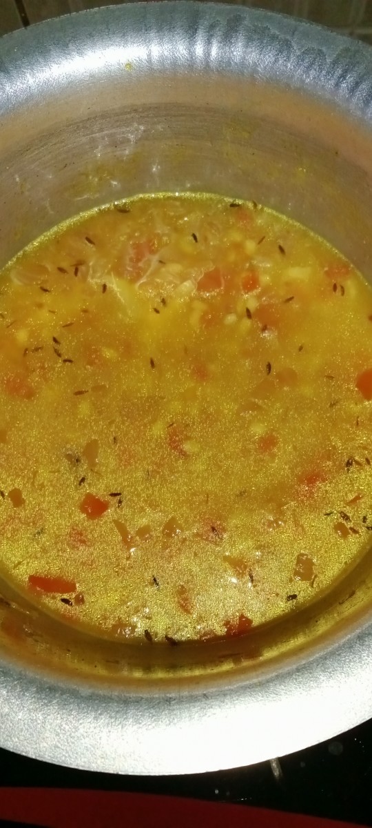 Add some water and cook the dal.
