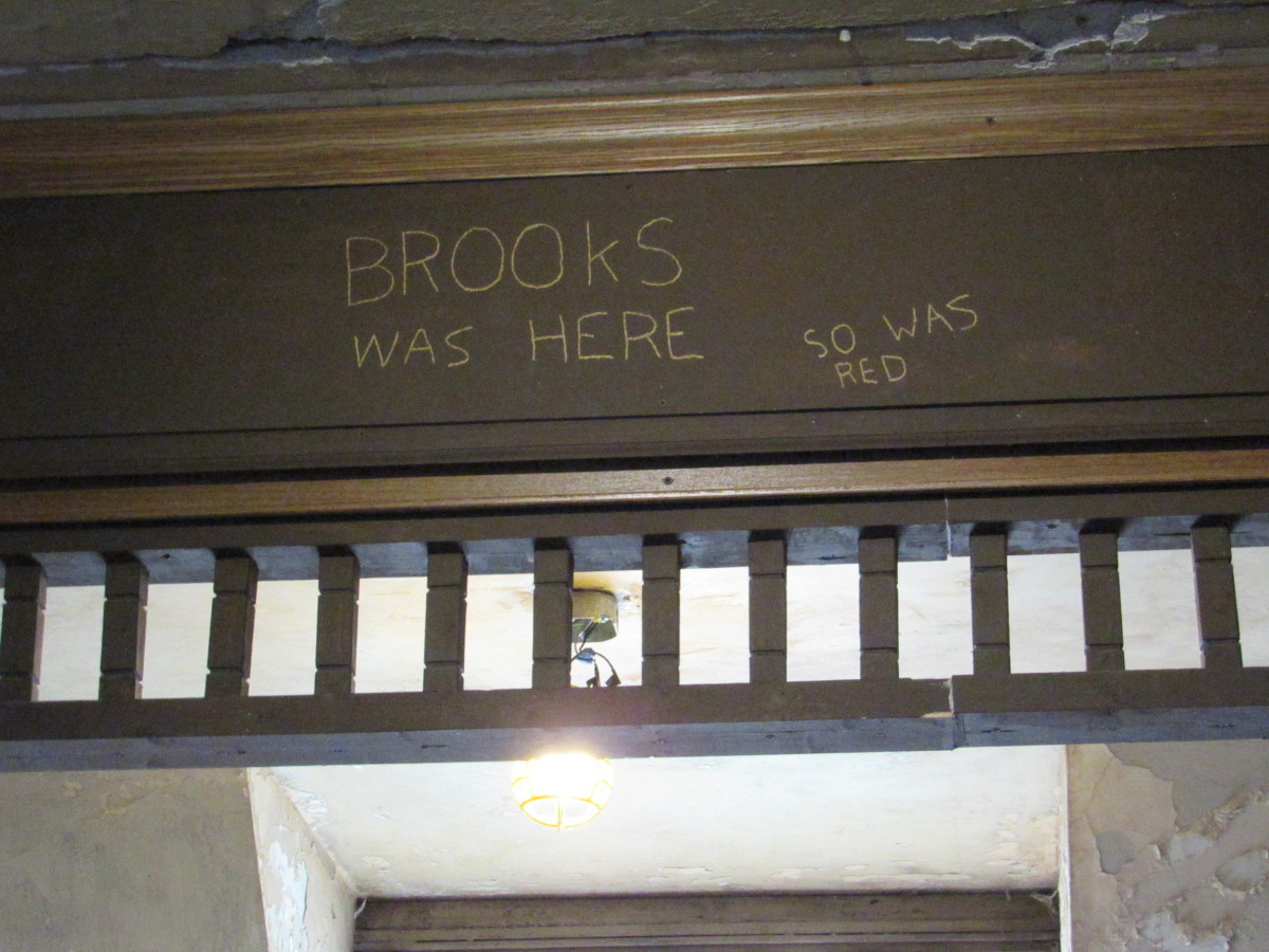 Messages carved by Brooks and Red inside the boarding room