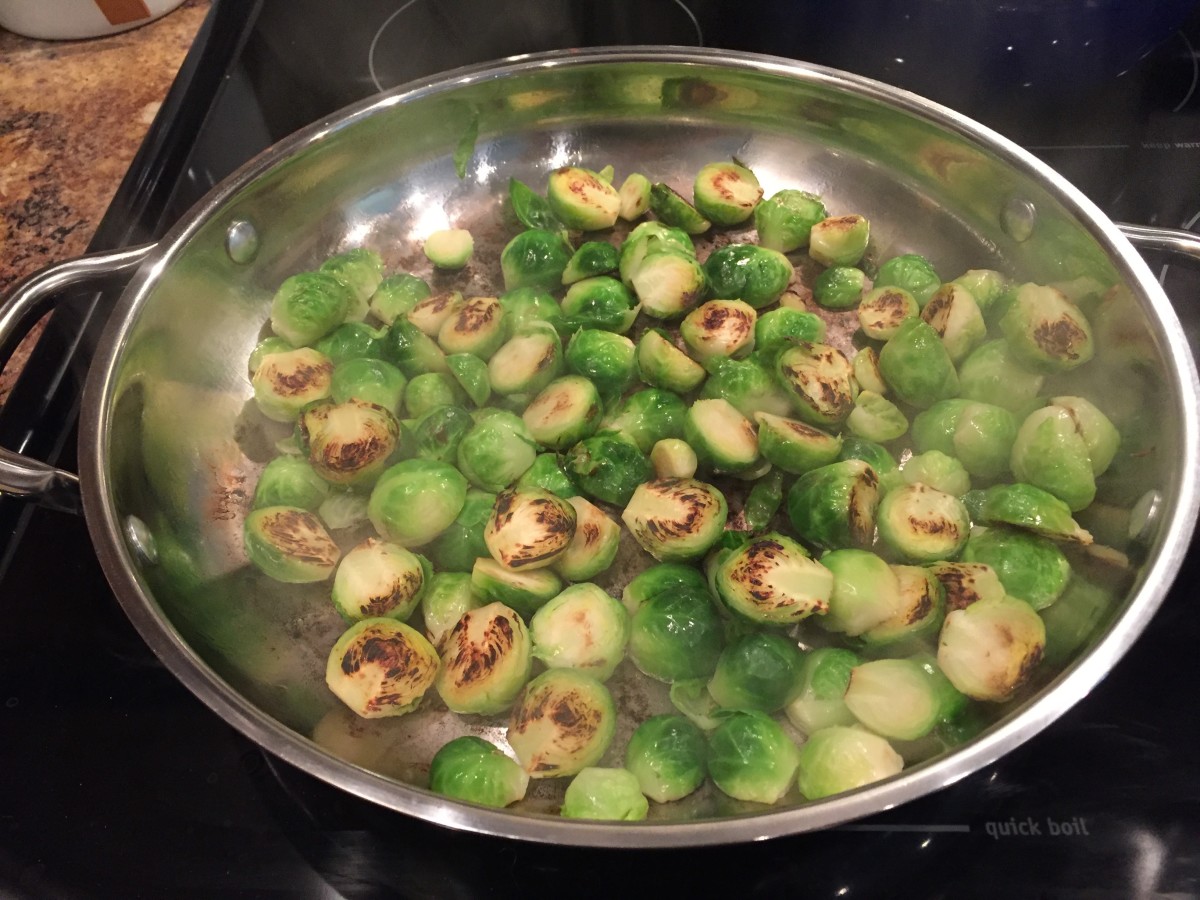 Halved sprouts browning on our stovetop.