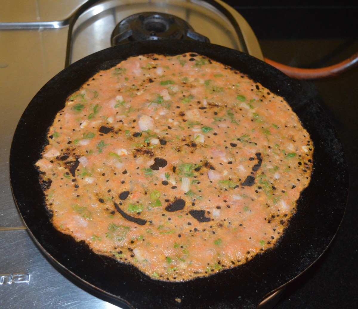 Step three: Add a few drops of oil to the edges and the surface. Let the dosa get golden brown on the bottom side and cook well on the surface too. No need to flip it.