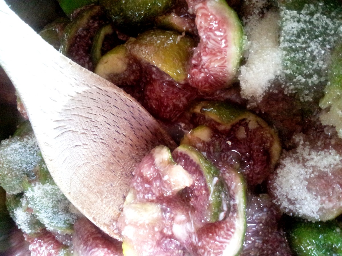 Stir over medium heat to break down the fruit.