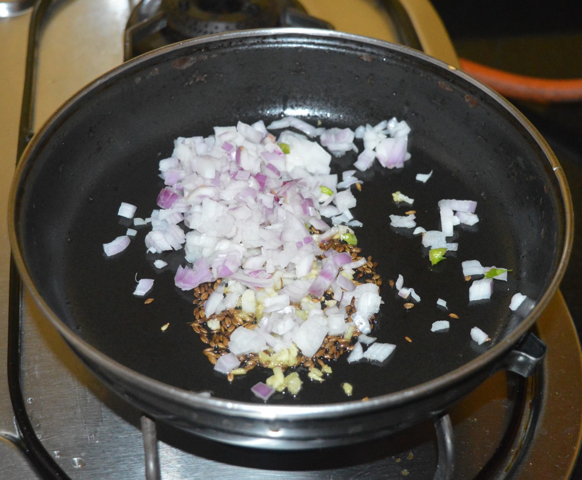 Throw in chopped onions. Saute the mixture until the onions become transparent.