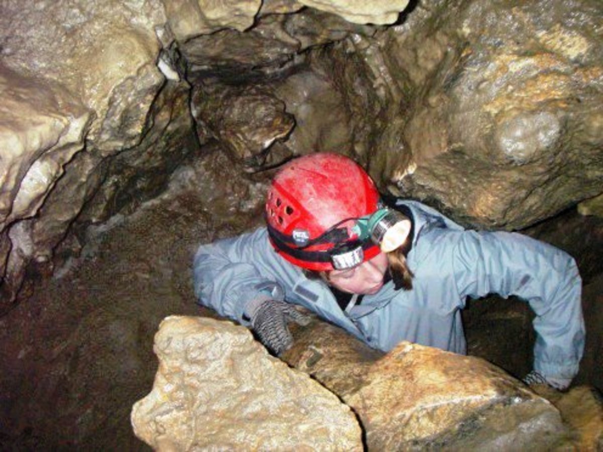 Caver explores subterranean passages in the Cody Cave system.