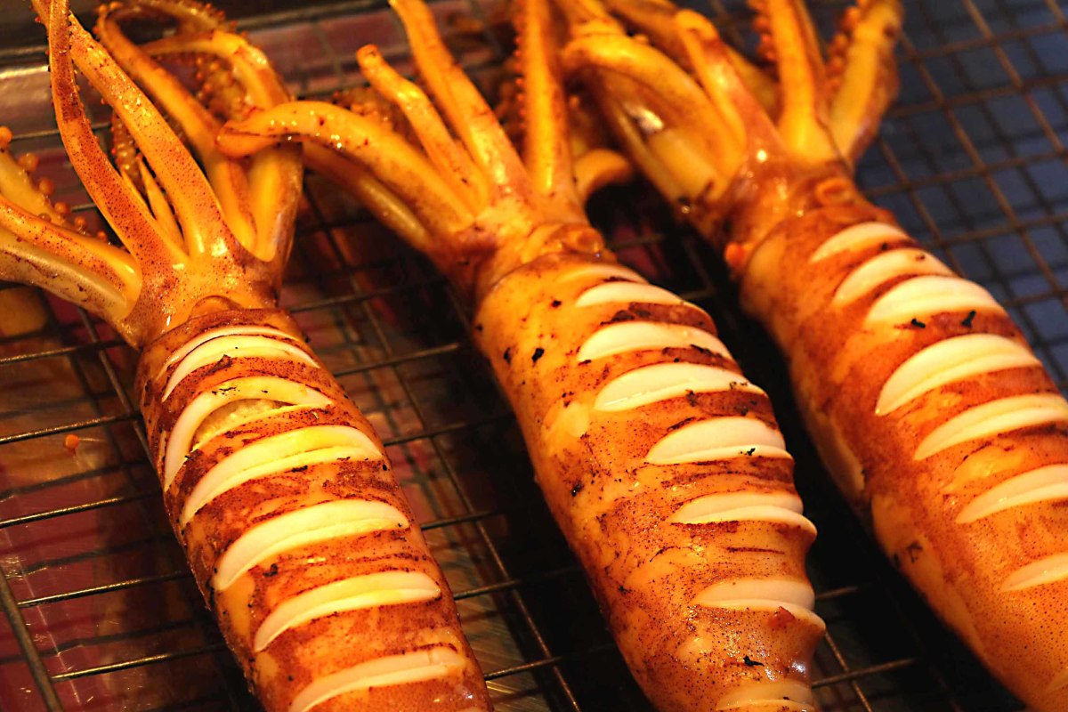 Squid, flattened in a press and grilled as a popular Thai snack