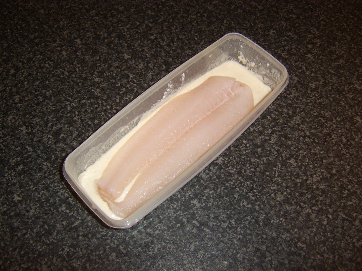 Whiting fillet is dipped in batter