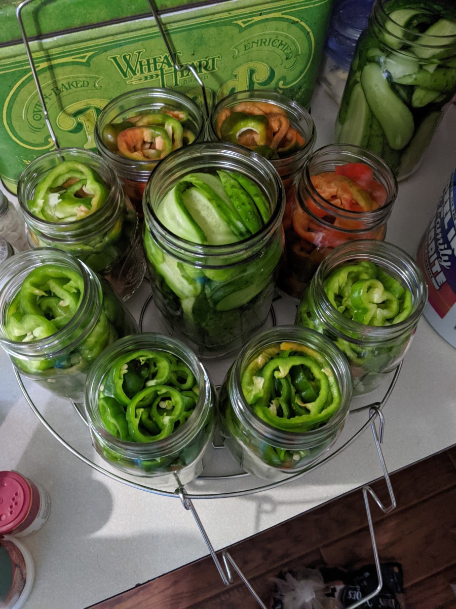 neatly fill the jars with peppers, leaving headspace at top.