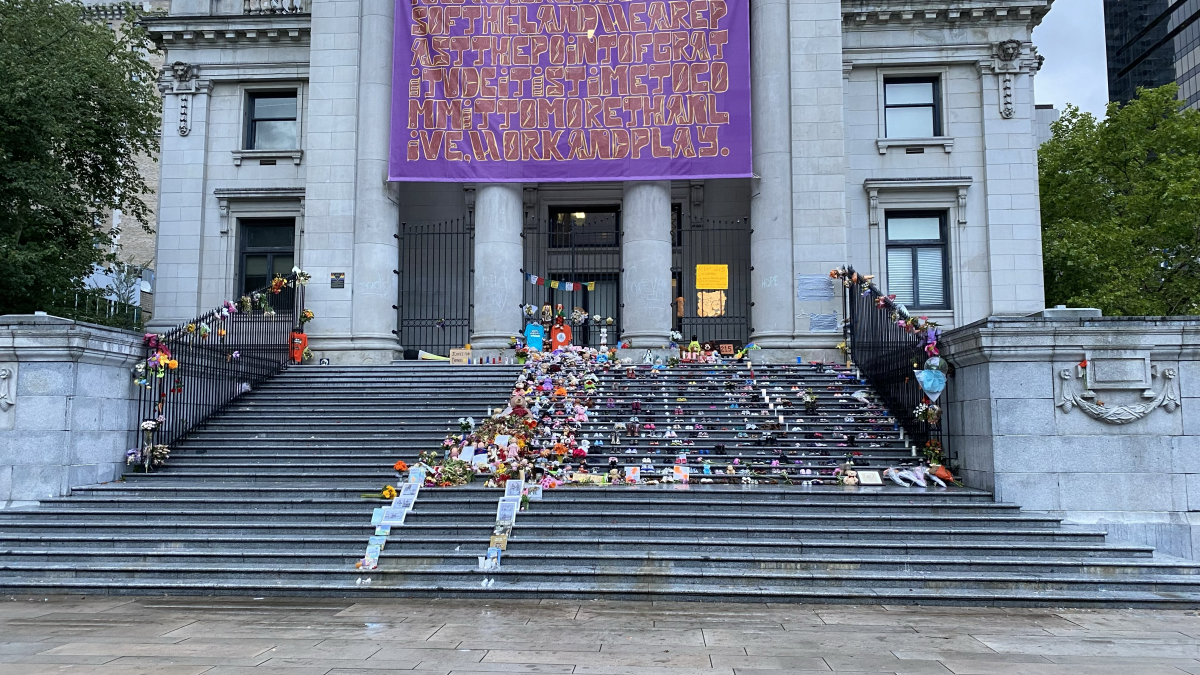 215 pairs of shoes laid in front of Vancouver Art Gallery in memory of the children at the Kamloops Residential School.