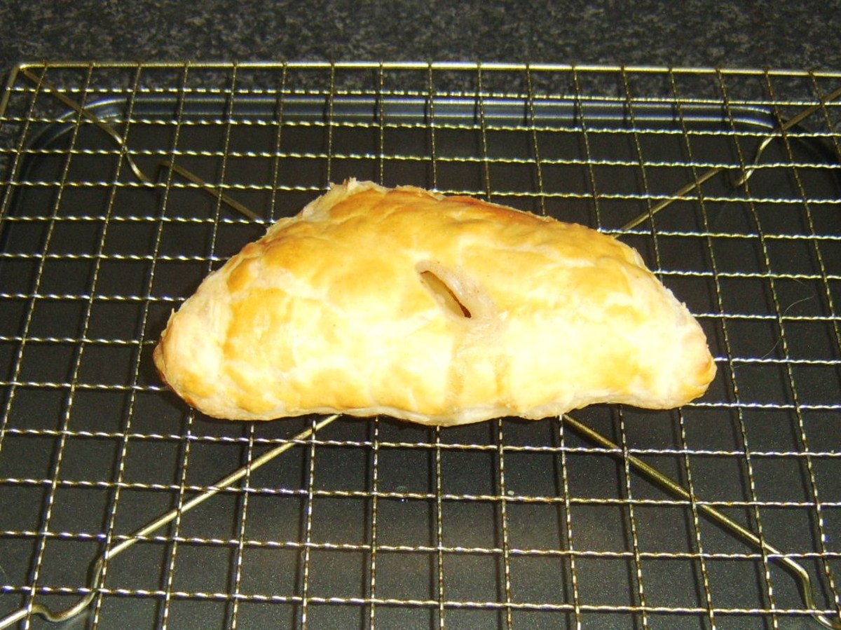 Apple and pineapple turnover resting when it is taken from the oven
